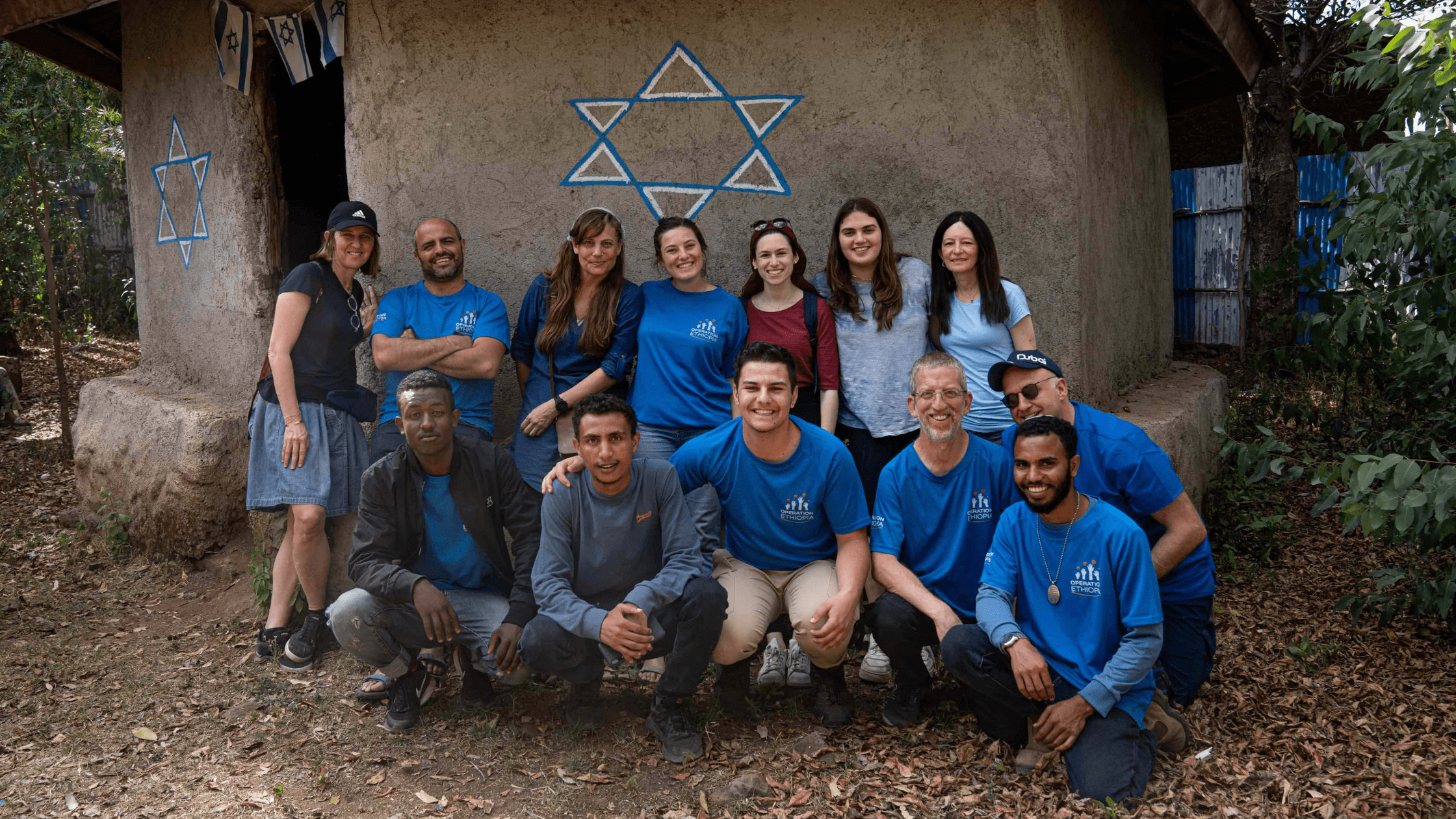 group of operation ethiopia workers in front of jewish star