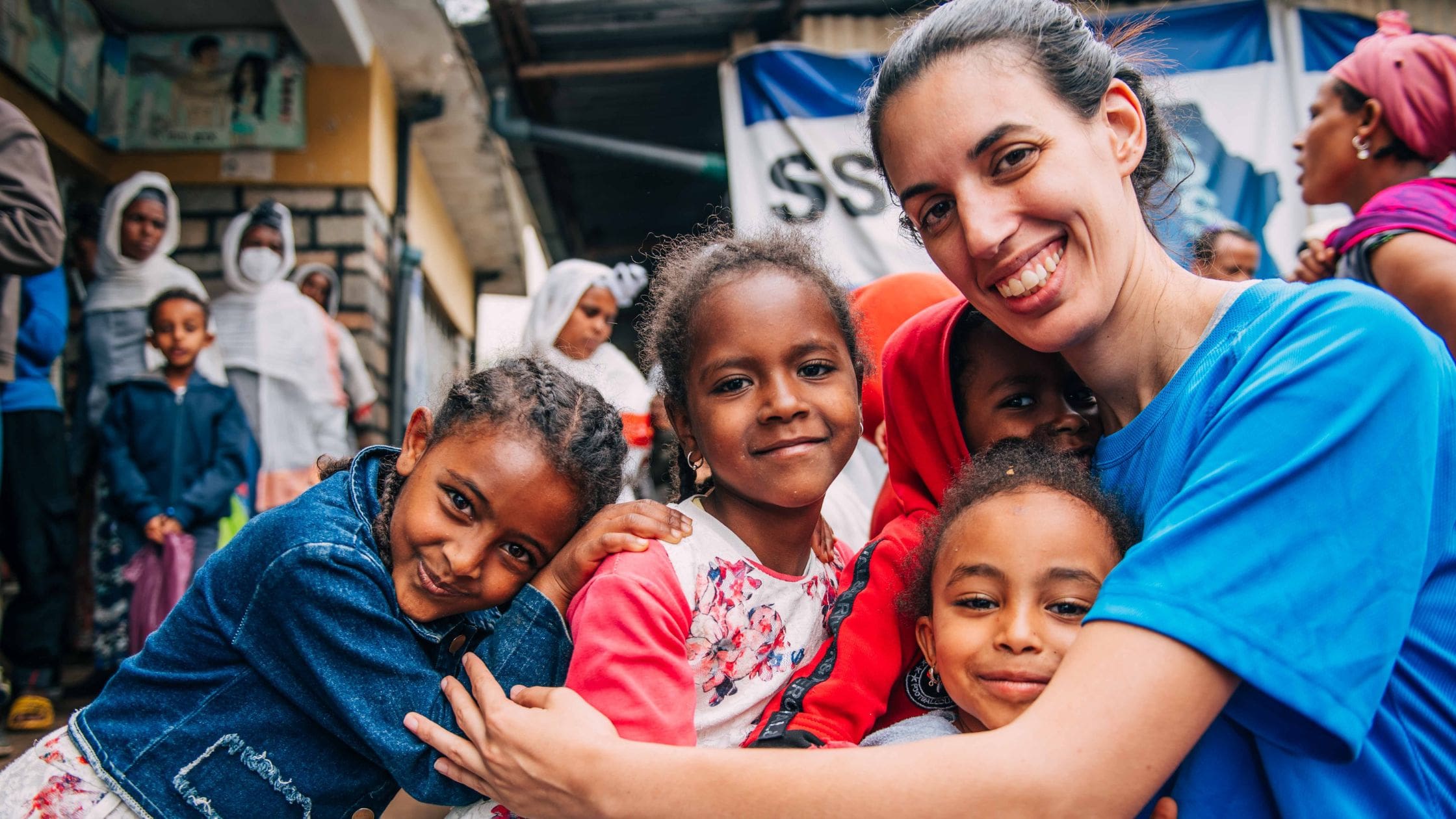 operation ethiopia volunteer hugging ethiopian girls